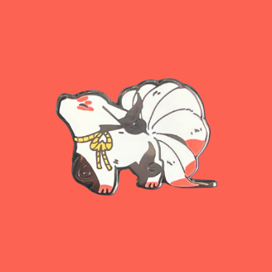 Enamel pin of a stylized animal character with red and white design