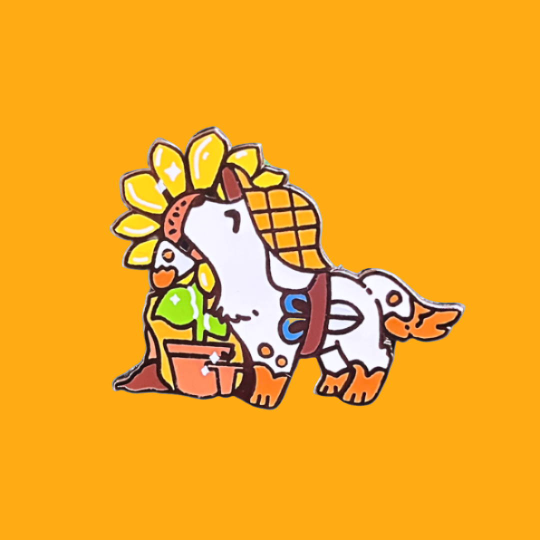 A colorful pin badge featuring an illustrated gardener character with a sunflower and gardening elements.
